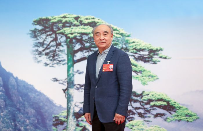 梁金辉在两会现场。受访者供图